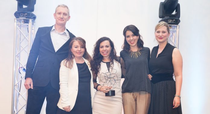 Three members of the LSE research development team flanked by a representative of award sponsor Worktribe and the ARMA awards MC.